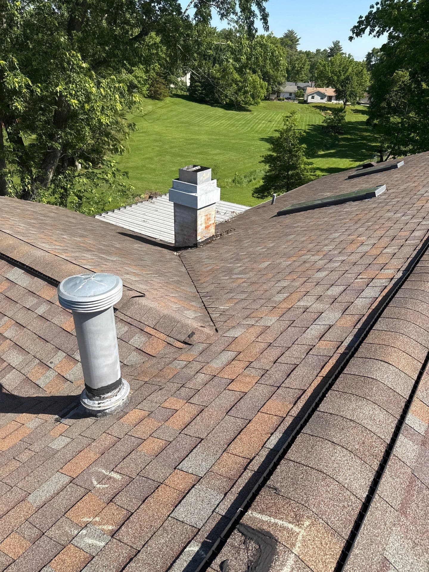 Existing roof valley, chimney, and vents documented during a Maryland Heights inspection