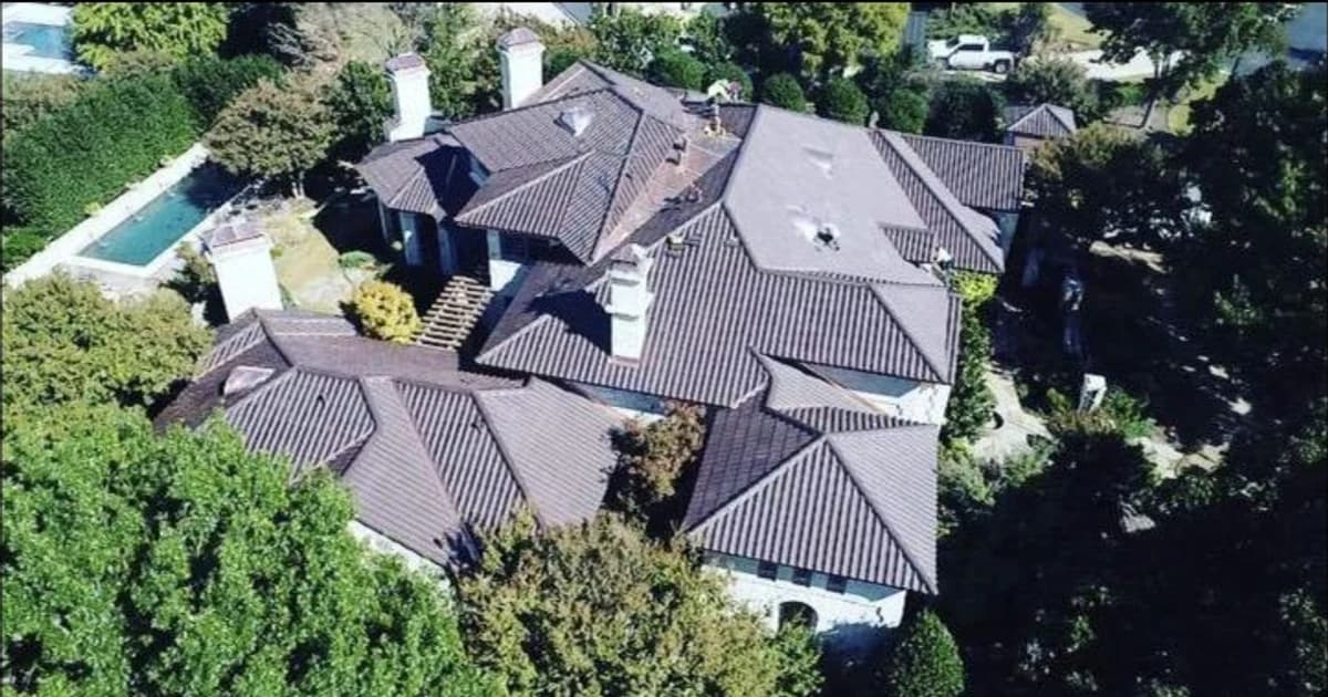 Luxury roof completed by Lapeyre Roofing overlooking Lake Travis