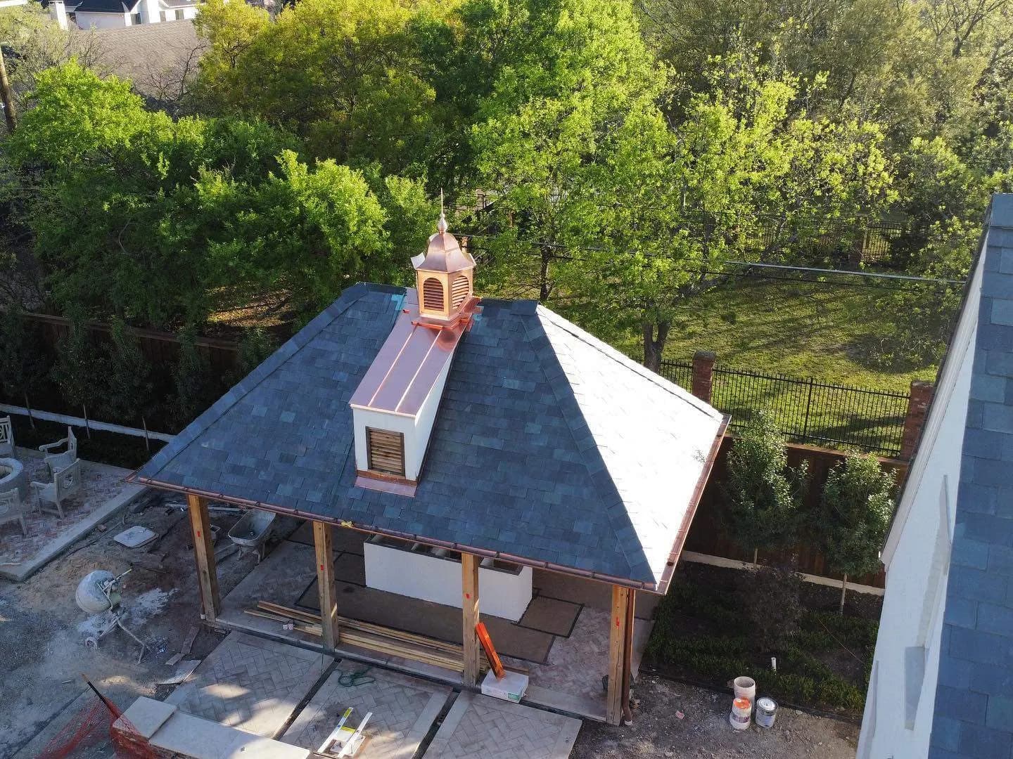 Finished slate roof with copper cupola and ridge, aerial view