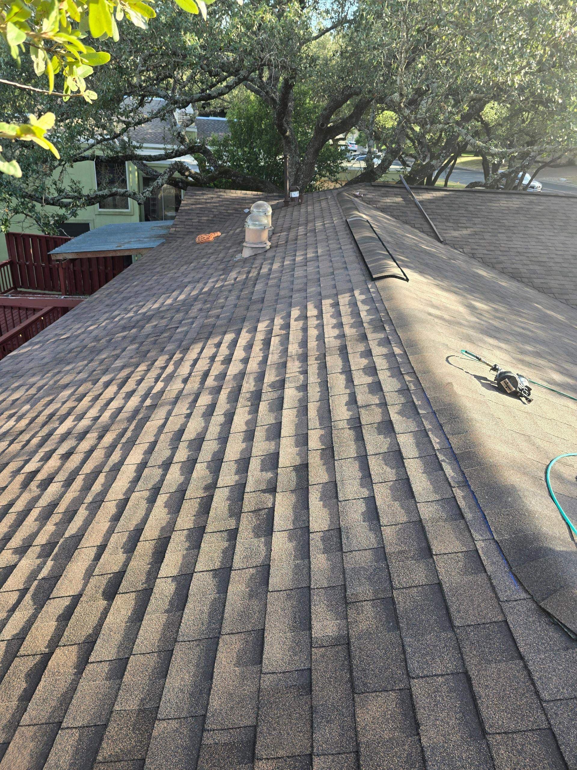 Architectural shingles and roof ventilation during an Austin roof installation in September 2025