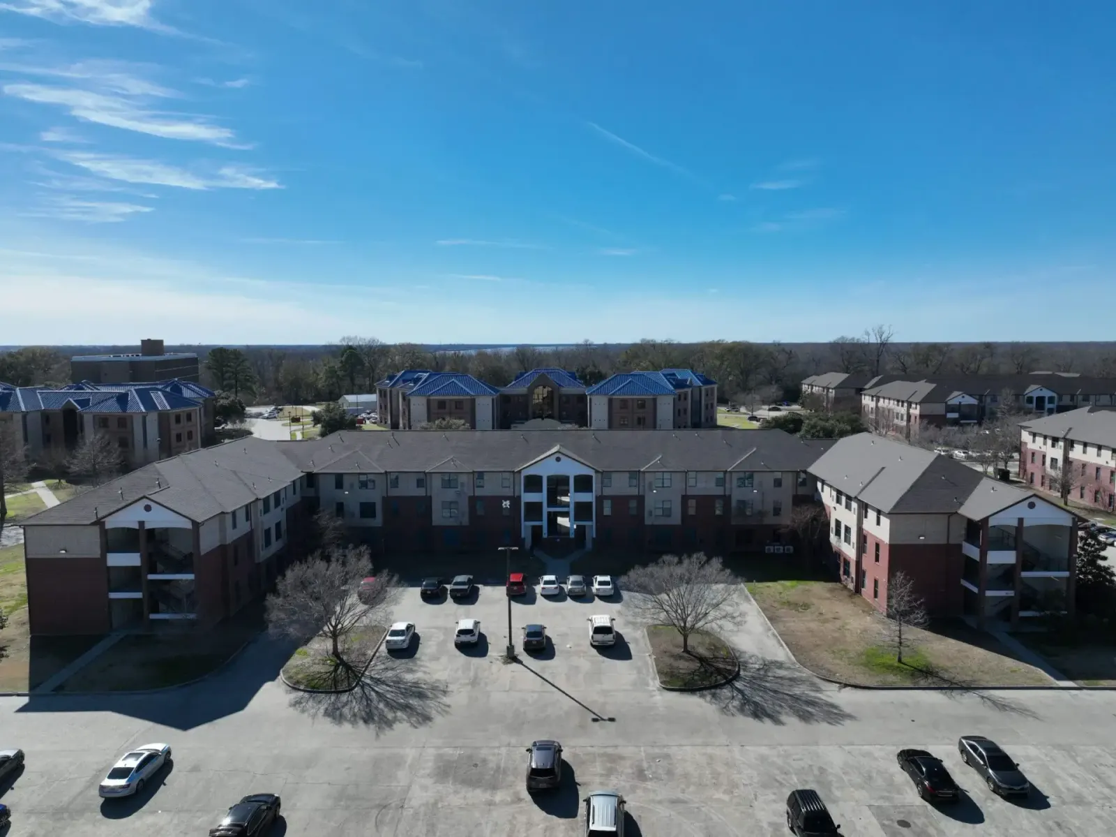 Aerial view of roofs across a multifamily property
