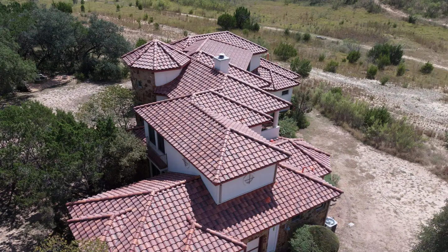 Aerial view of a completed tile roof on an estate residence