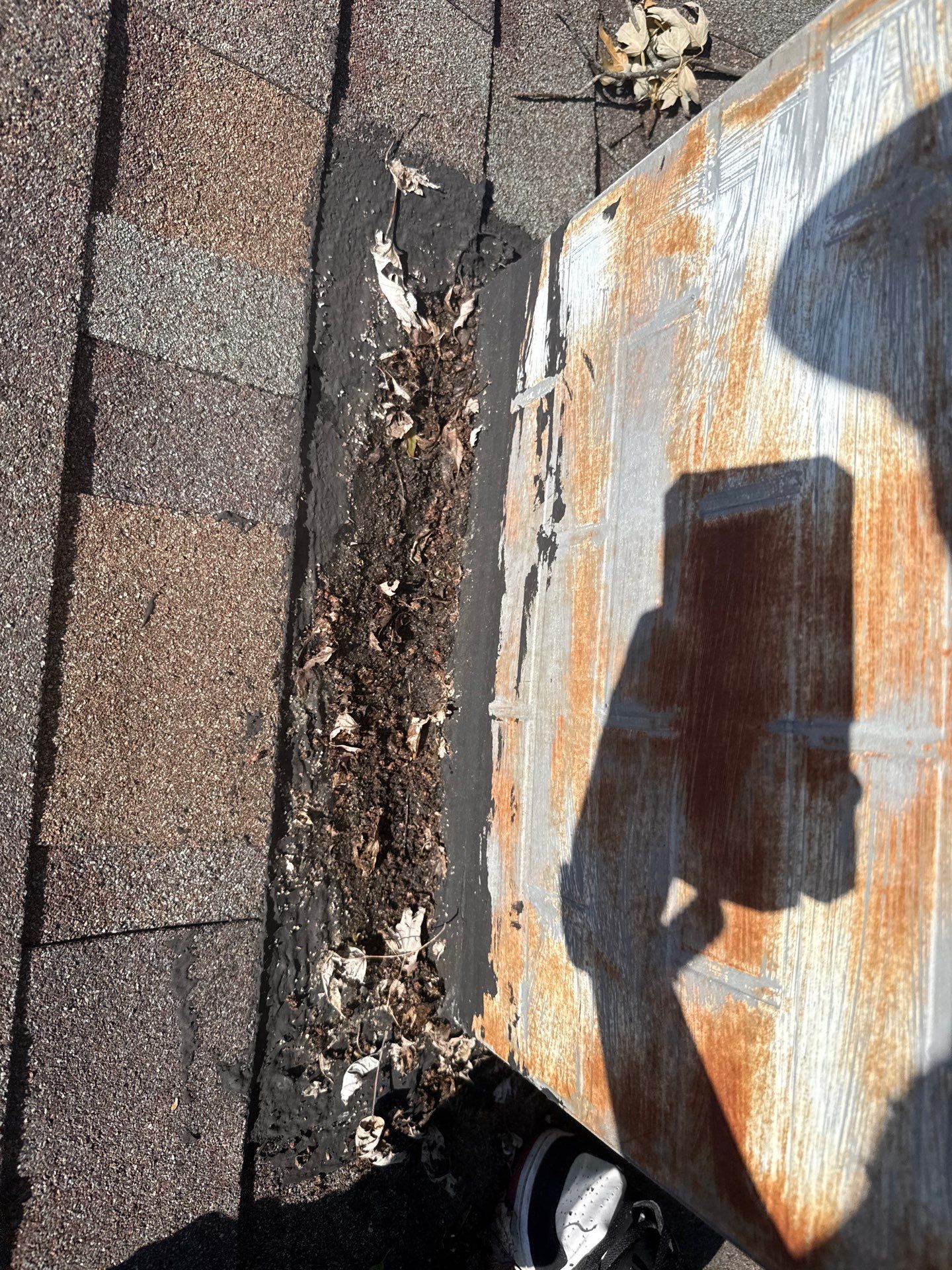 Existing chimney flashing, patching, and accumulated debris documented in Maryland Heights