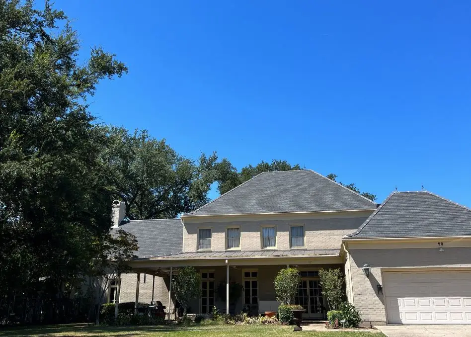 Roofer installing a residential roof in Louisiana.