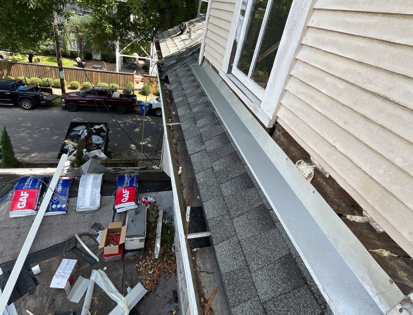 Lapeyre Construction team performing professional gutter installation